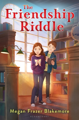 The Friendship Riddle in red letter on top boy and girl looking at note book inside room. bookshleves around them. light from lamp and windows behind.