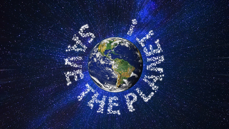 dark blue space with stars middle Earth with South America outline showing. white letters around 'Save the Planet!'