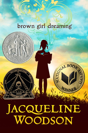 book cover has three colours in background. blue on top, yellow clouded sky in middle and brown shaded grass. girl in silhouette standing in middle holding book. swirly pattern in yellow rises to top of cover. brown girl dreaming in brown letters above girl. Jacqueline Woodson in large yellow letters at bottom. seals of three book awards on front.