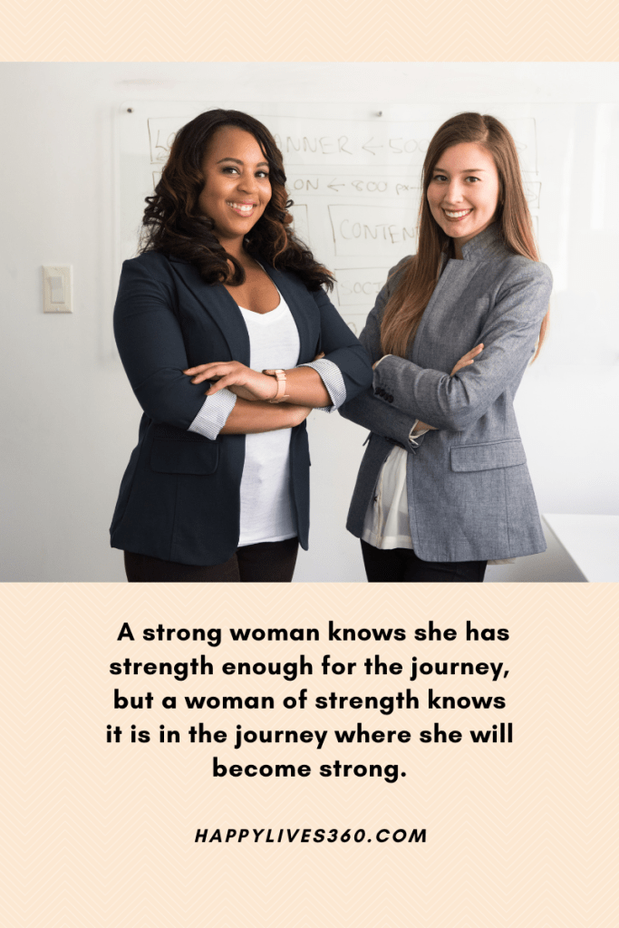 light pink background. photograph of two women in middle. both standing in dark blazers with arms folded. one African American and other Caucasian, both smiling. quote at bottom reads 'A strong woman knows she has strength enough for the journey, but a woman of strength knows it is in the journey where she will become strong. Happylives360.com'