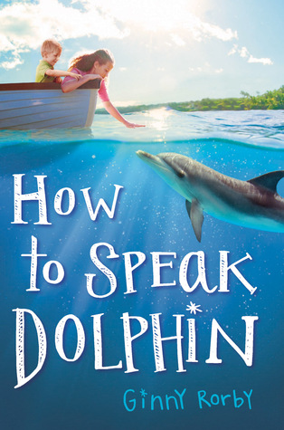 cover image of boy and girl inside boat looking at dolphin in clear water. trees and sun along skyline along top. white letters on sea read How to speak dolphin.