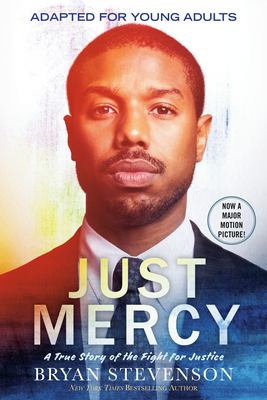 cover image of African American man in blue suit. slight orange hue on left side. white letters Just Mercy along bottom.