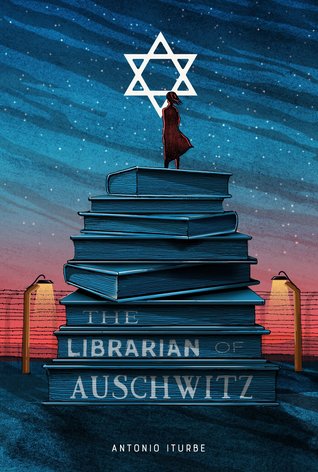 cover image of stack of books and girl standing on top of it. white star above her and fences along bottom. dark night sky. last three books have words The Librarian of Auschwitz on them.