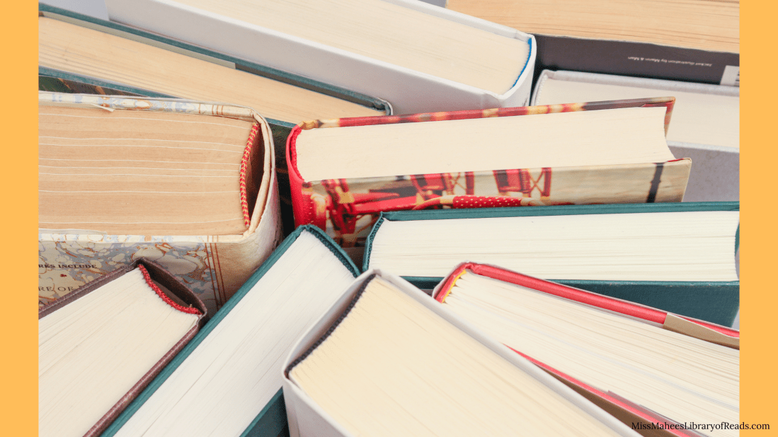 banner image of books taken from top of spine. background in orange around left and right edges.
