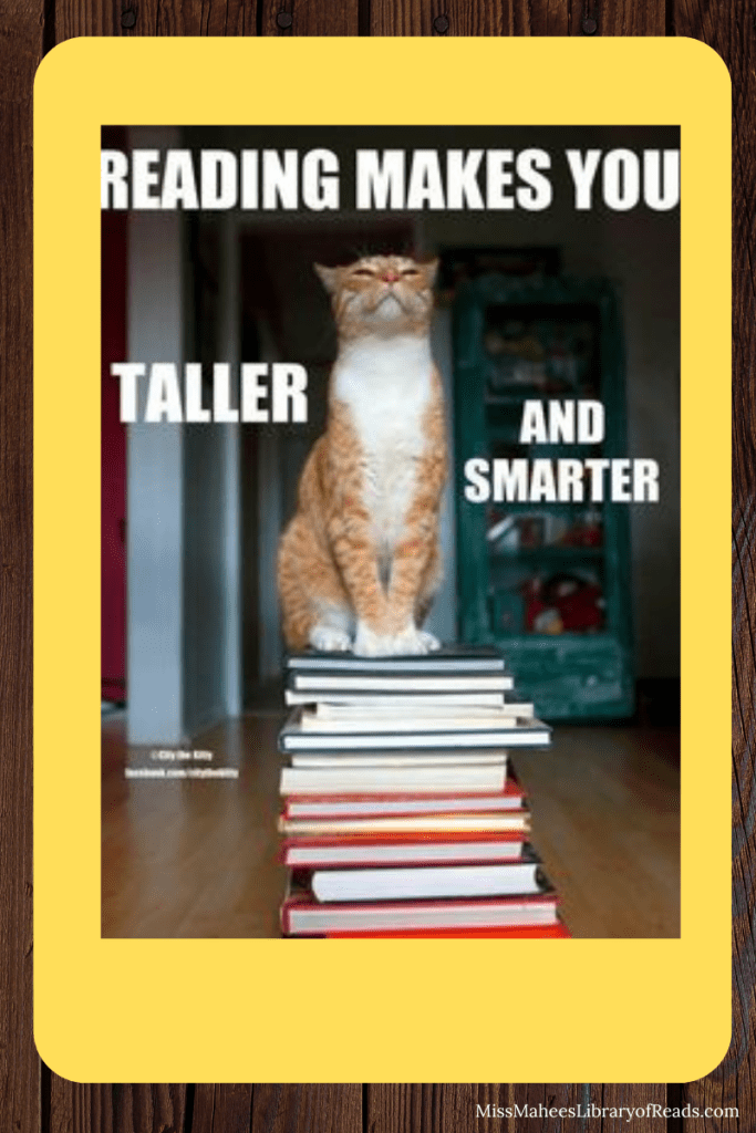 image of tabby cat standing on top of stack of books in middle. white letters around him reads 'Reading makes you taller and smarter.' yellow box around image and dark brown behind that.