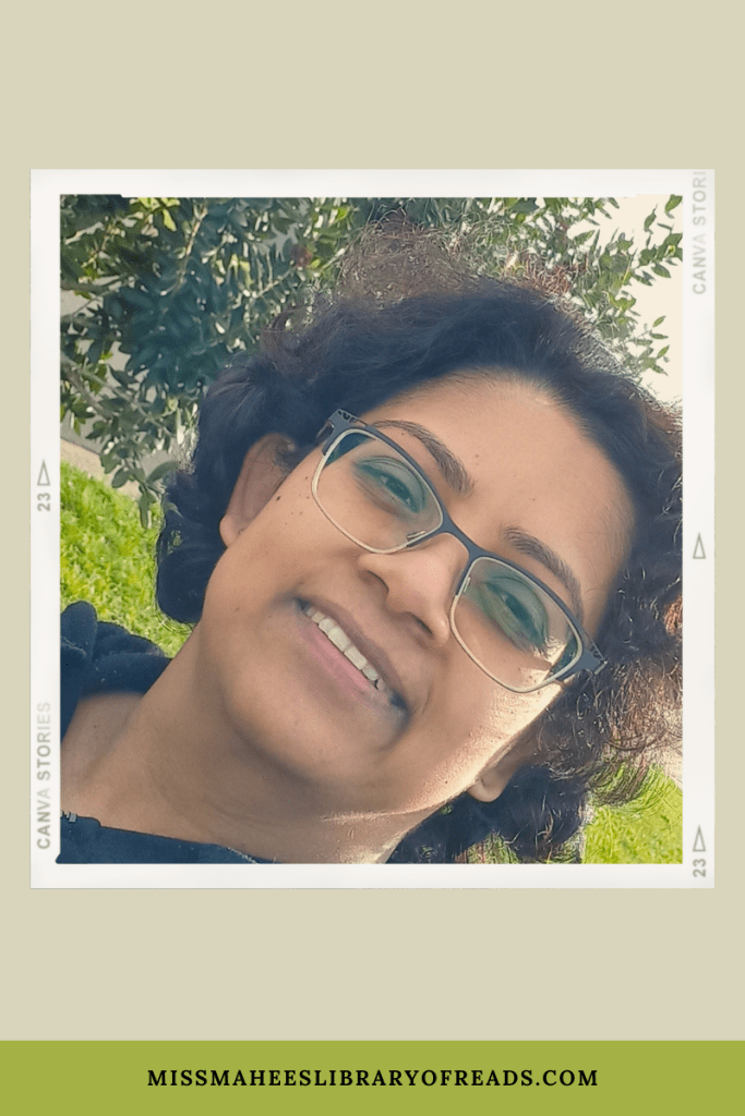 image of woman in front of tree with glasses. light green background. dark green band at bottom with MissMaheesLibraryofReads.com.