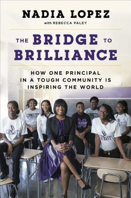cover image of African American students with female teacher seated inside classroom wearing white t-shirts and dark pants. teacher in black blouse and purple skirt. white ceiling above them. purple letters above reads The Bridge to Brilliance. black letters above that reads Nadia Lopez.