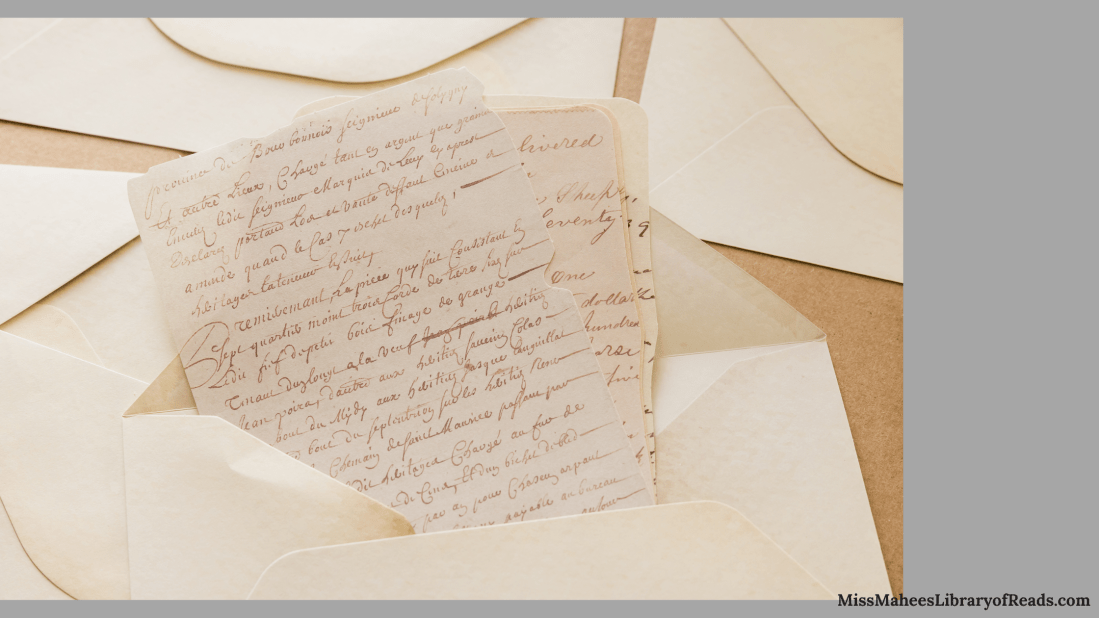 image of handwritten letters from inside open white envelope. few closed envelopes around it. grey background.