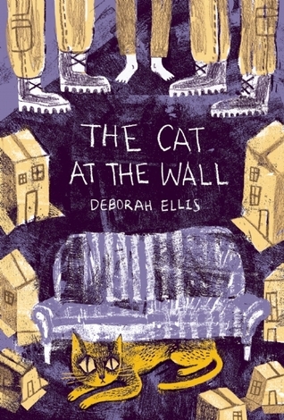 cover image of orange yellow cat under blue and white striped sofa. pencil drawings of yellow houses around sofa and feet of two men in boots and barefoot boy. white letters in middle reads 'The cat at the wall.'