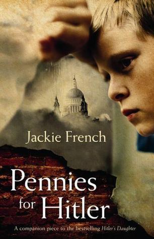 image of boy in top right corner looking out. St Paul's cathedral dome in clouds in middle. red brick background in bottom left edge with white letters on them reading Pennies for Hitler. Jackie French in white in middle white clouds.