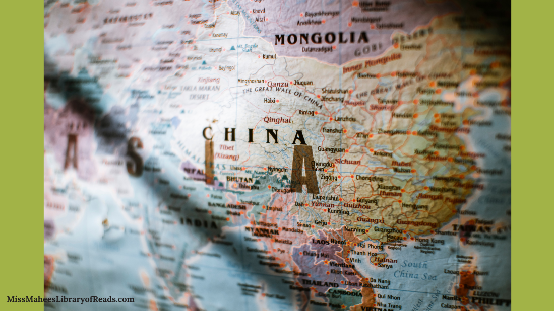 portion of map of Asia in middle of banner. ASIA, CHINA, MONGOLIA visible in dark letters. shadow of something straight falls across S in Asia. green background.