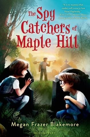 cover image has two kids crouching behind gravestones in cemetery. girl on left with short brown hair and blue dress while boy of right has pants and white t-shirt and glasses. man in centre holding shovel behind neck. trees and other graves in back with evening sky behind them all. red letters at top reads The Spy Catchers of Maple Hill and smaller yellow letters at bottom reads Megan Frazer Blakemore.